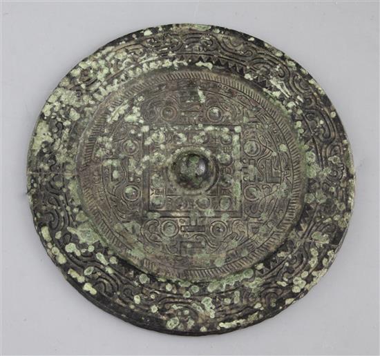 A Chinese bronze circular TLV mirror, Han dynasty, 1st century B.C. 15cm diameter, repaired